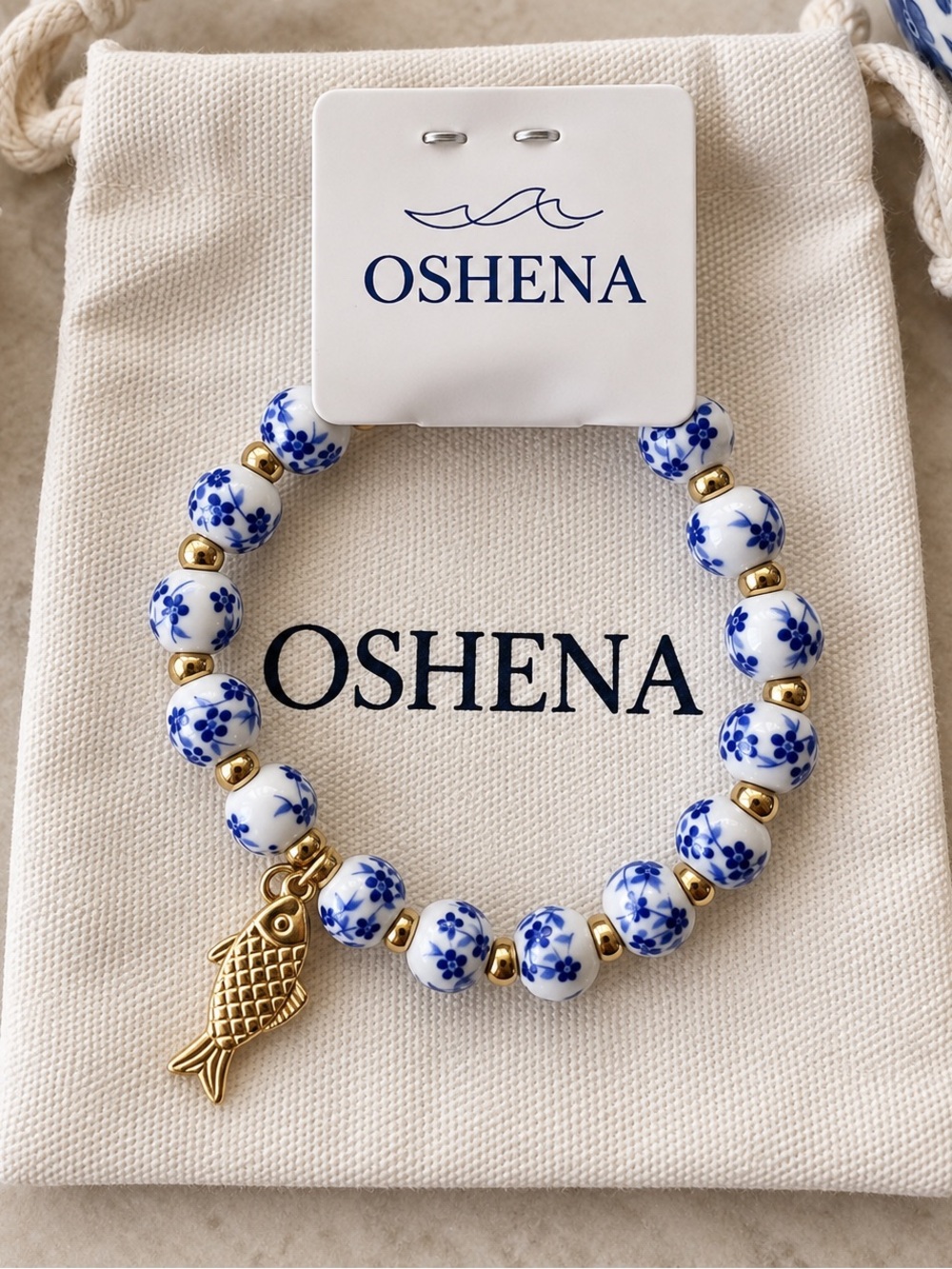 OSHENA Porto Azul Blue White Beaded Bracelet Gold Fish Charm NWT